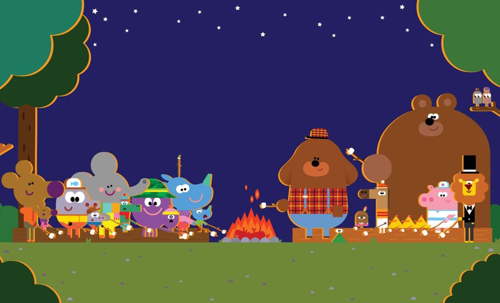 Cut out to see the campfire, the sun has gone down and everything looks cosy around the fire. Duggee and the Squirrels are all sat around on logs with their parents, toasting marshmallows.